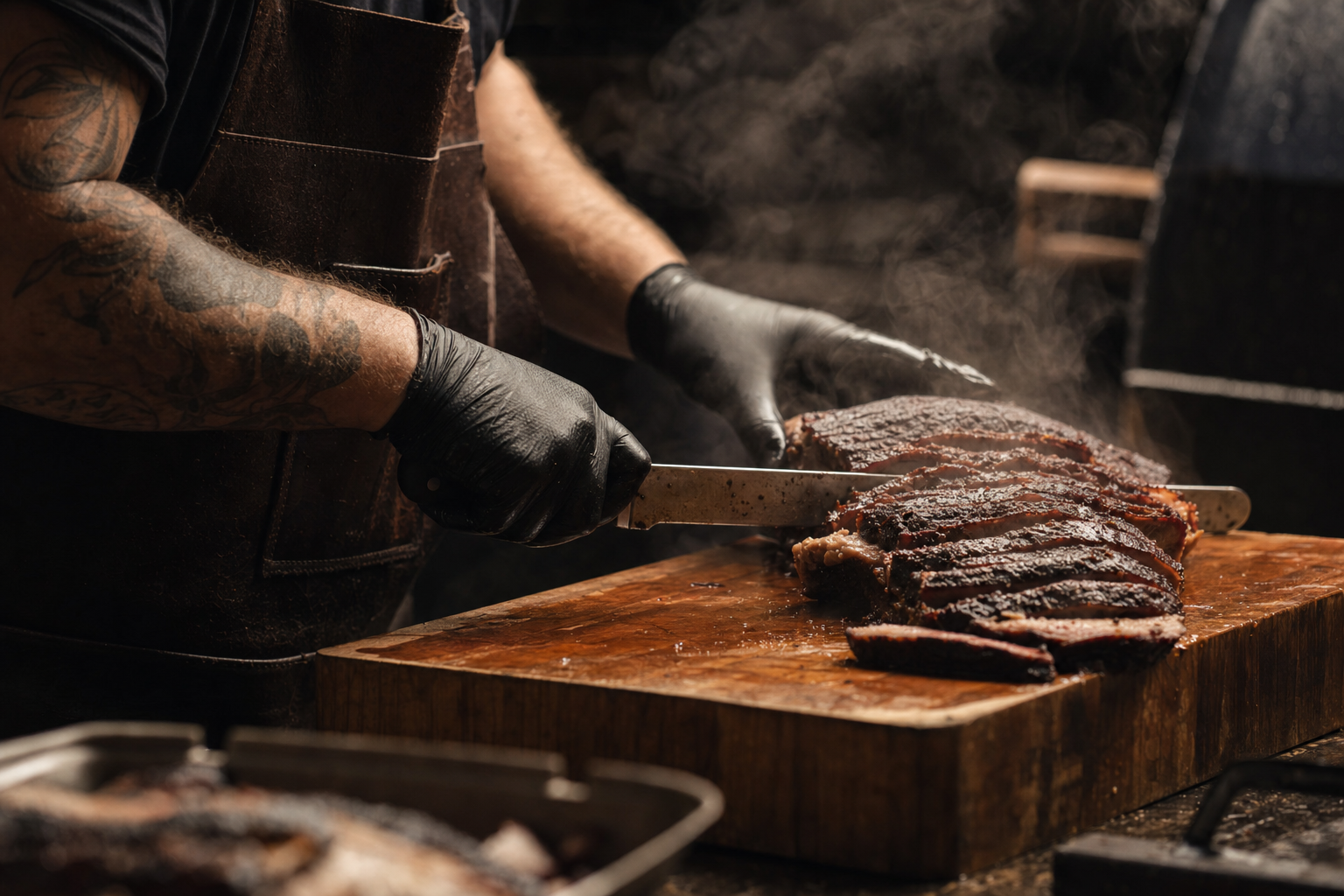 Bobby slicing a smoked brisket on a wooden board, steam rising